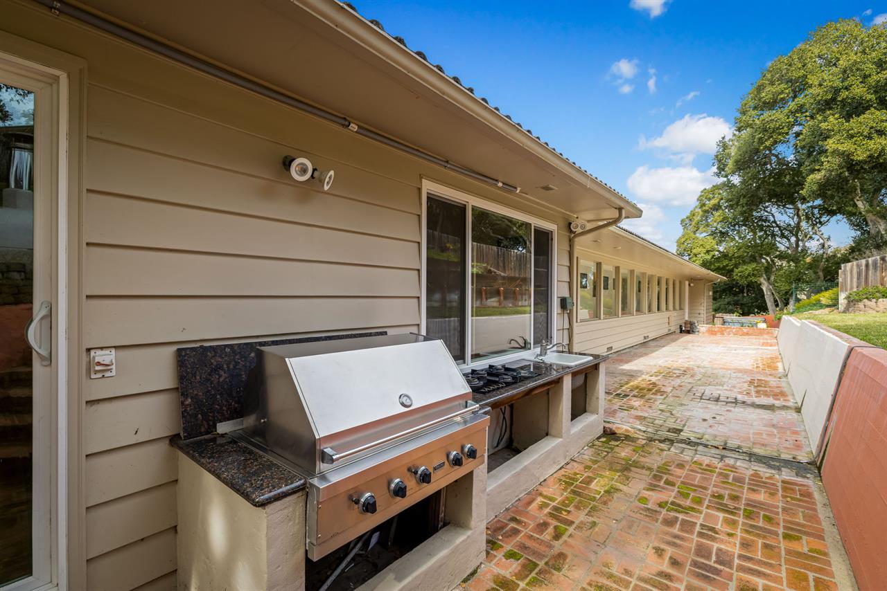 Backyard has an Outdoor Kitchen Area