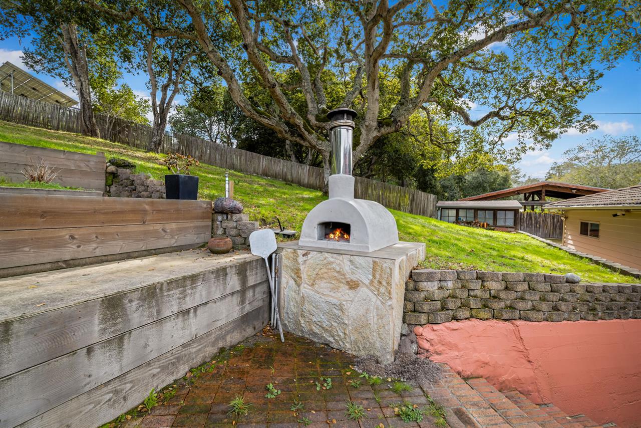 Backyard has a Pizza Oven