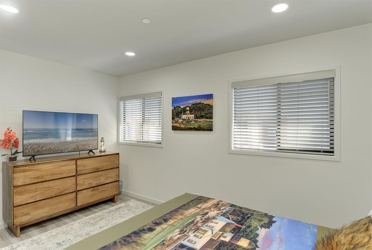 Bedroom 1 has a Queen Bed and TV