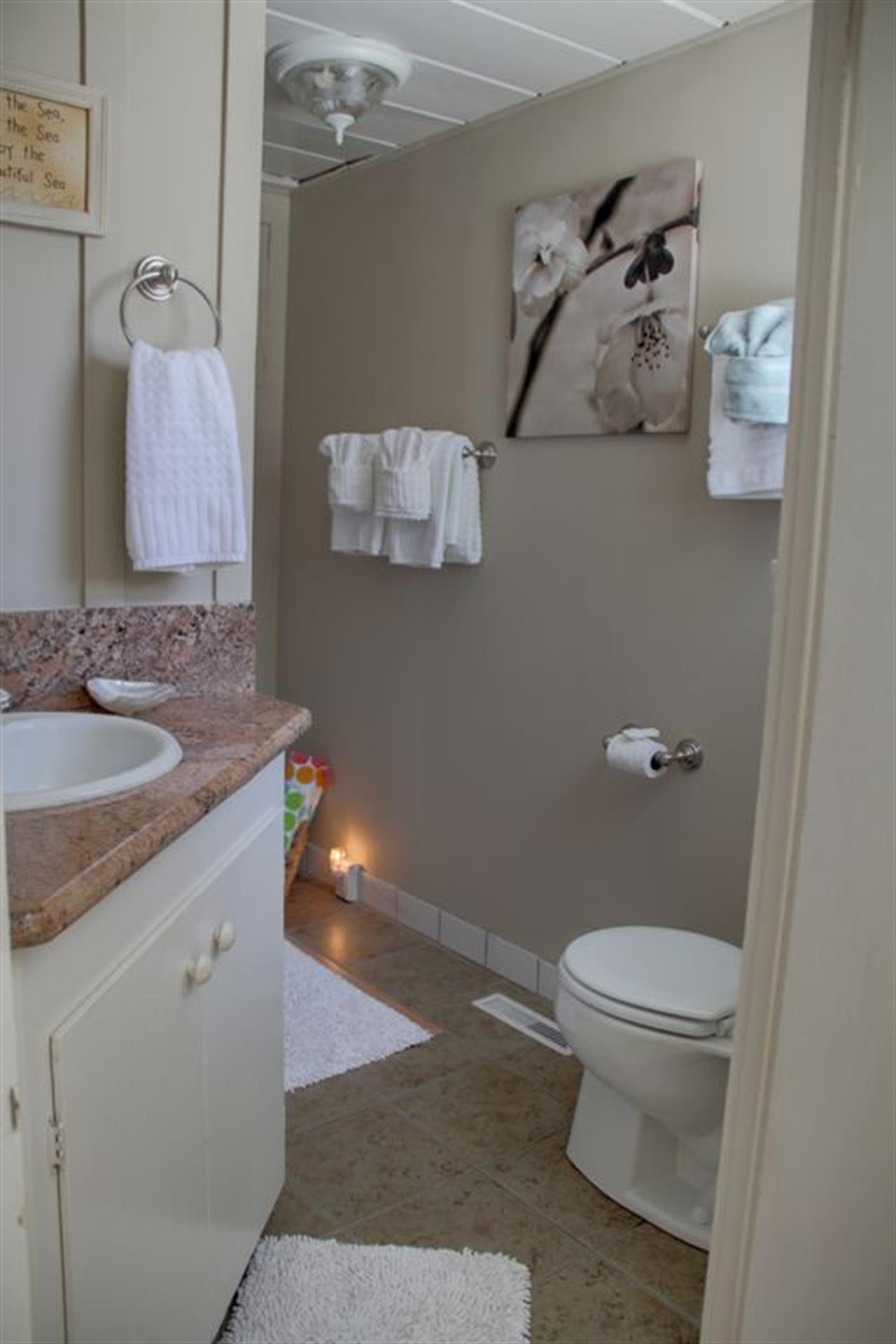 Sweet Bath with Designer Touches and Custom Tile