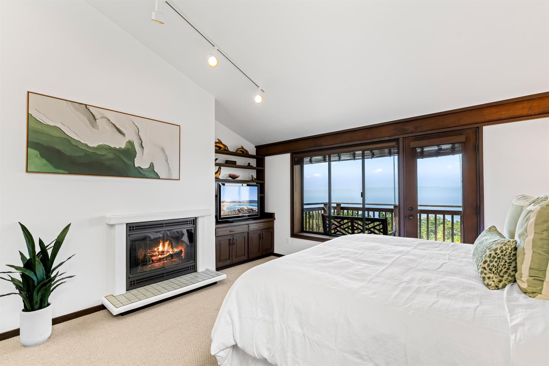 Bedroom 1  King Bed, WoodBurning Fireplace and Ocean View