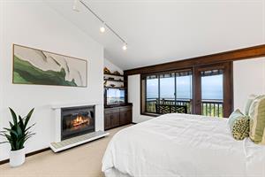 Bedroom 1  King Bed, WoodBurning Fireplace and Ocean View