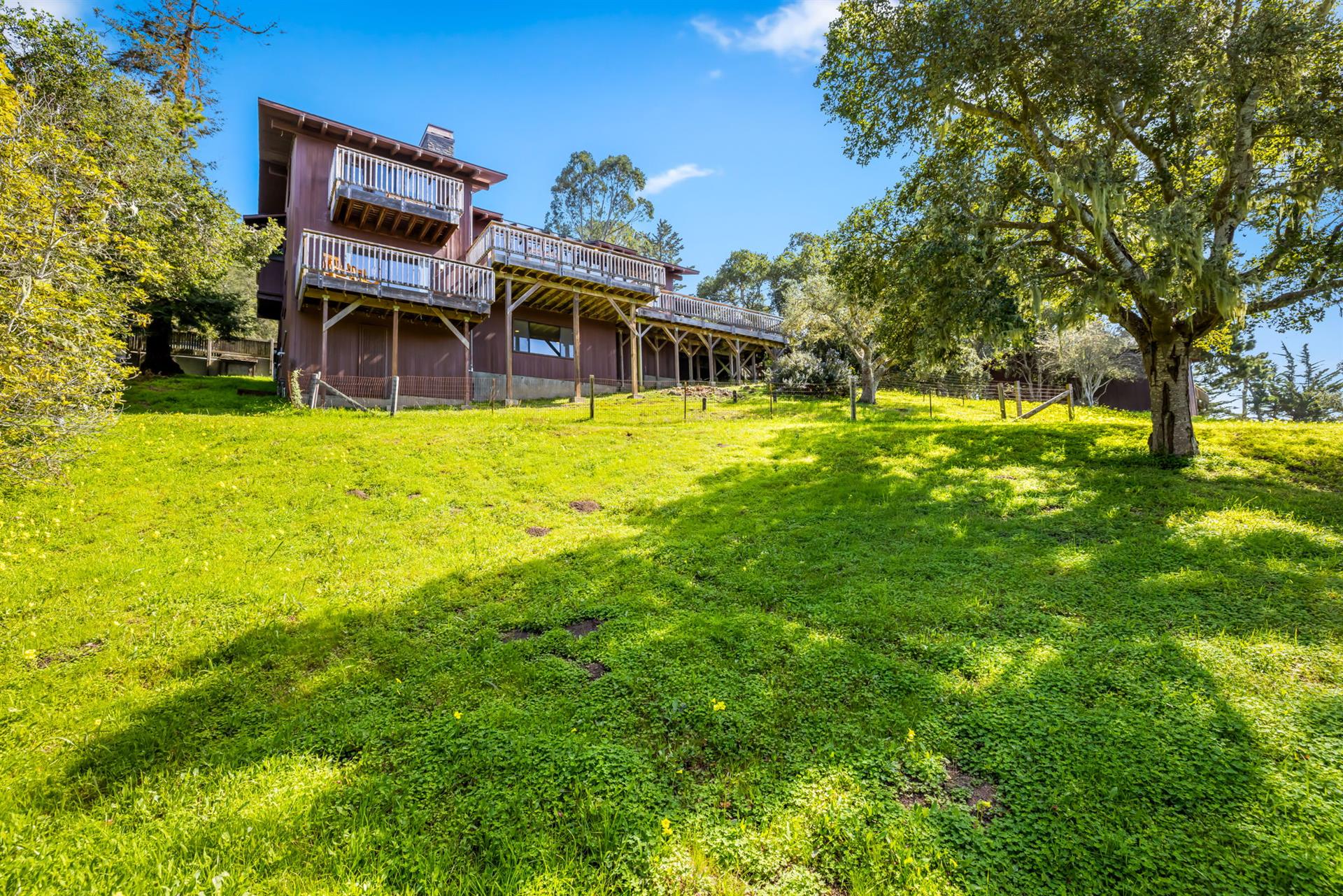 View of the Back of the Home from the Huge Backyard