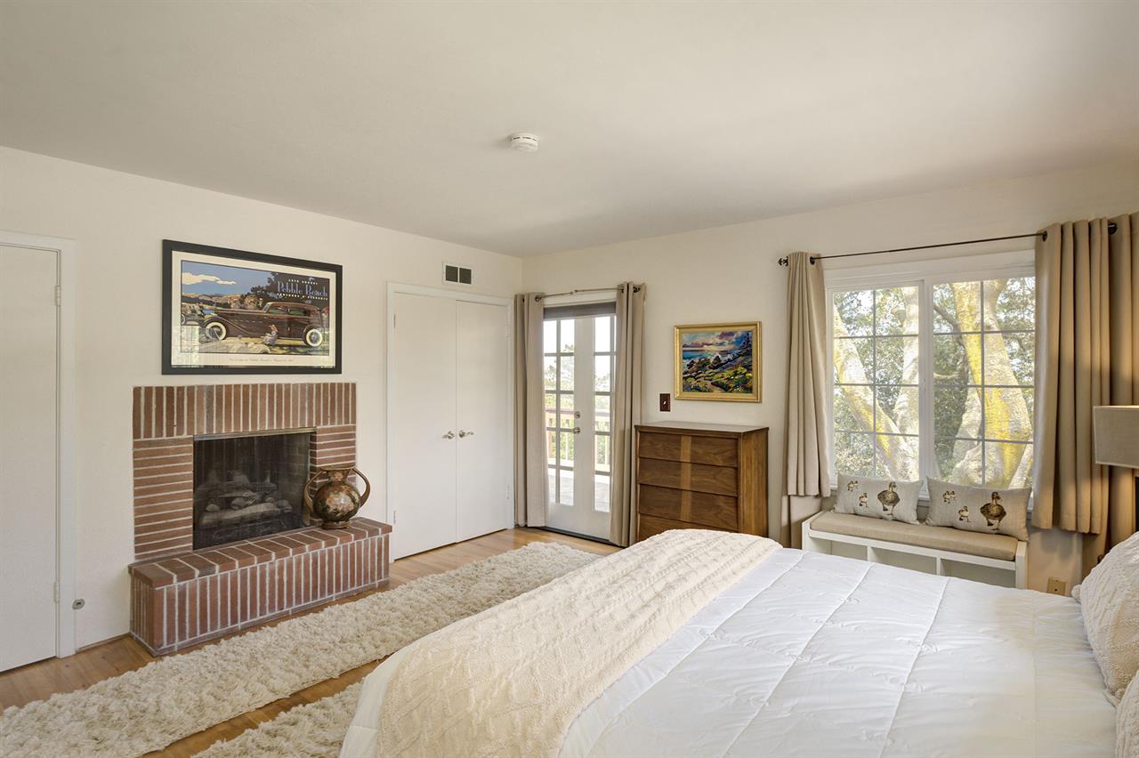 Bedroom 1  King Bed and a Decorative Fireplace