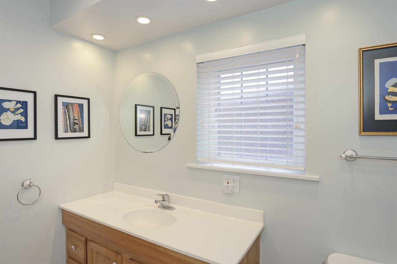 Bathroom 2  has a Shower Over a Deep Soaking Tub with Jets
