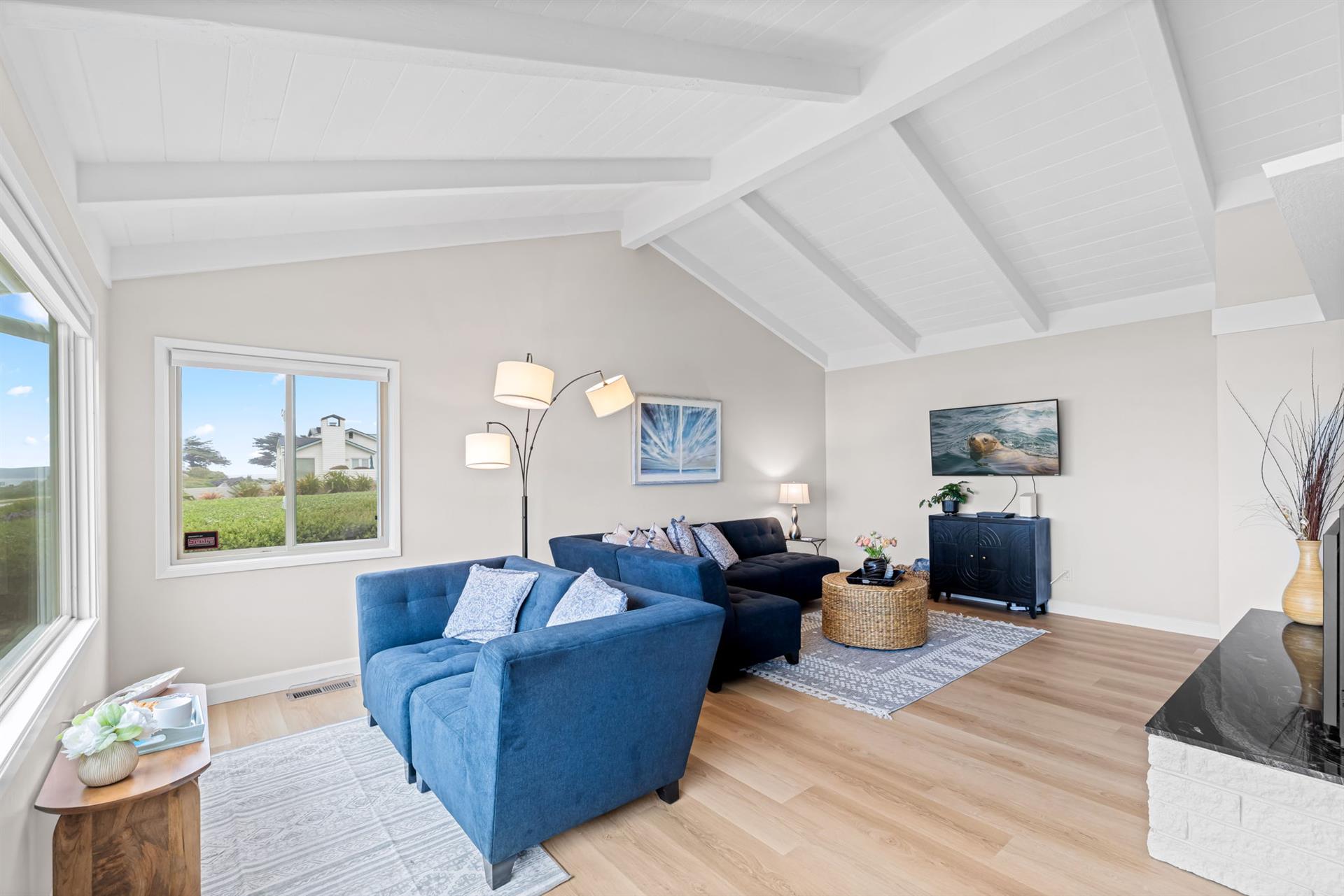 Living Room with Gas Fireplace, Smart TV and an Ocean View