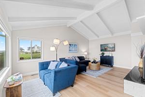 Living Room with Gas Fireplace, Smart TV and an Ocean View