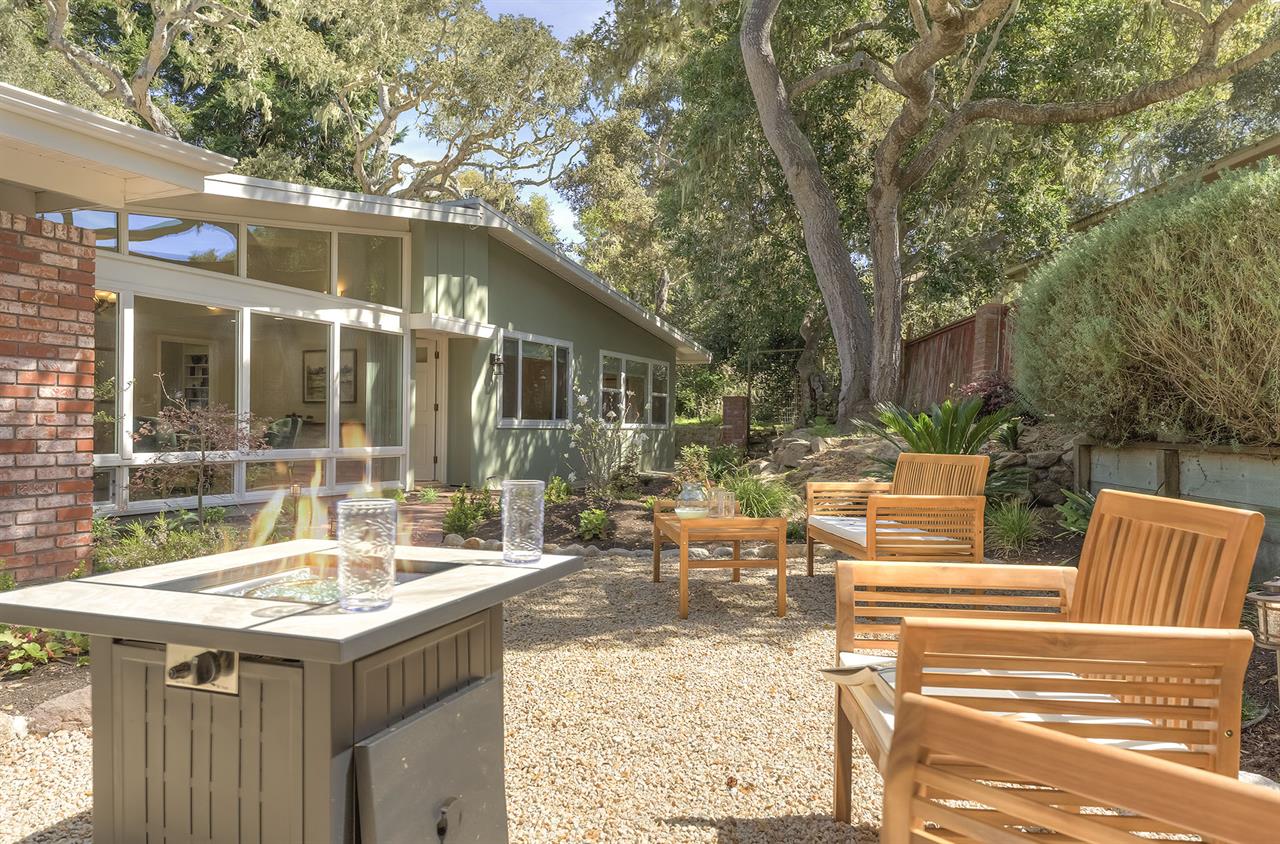 The Backyard has a Large Patio Area with a FirePit