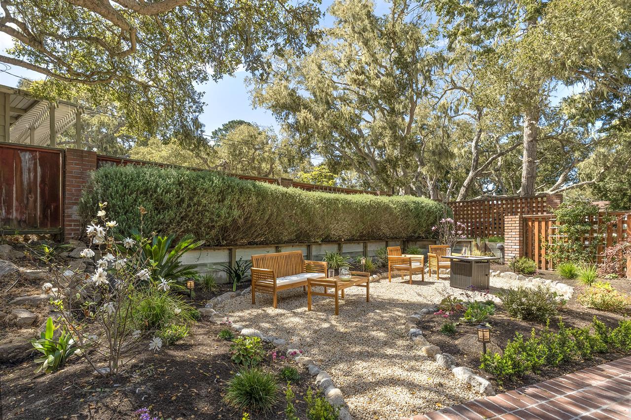 The Backyard has a Large Patio Area with a FirePit