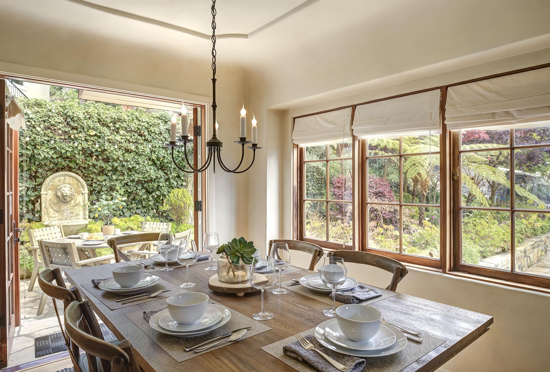 Dining Area Opens to the Patio with a Water Fountain