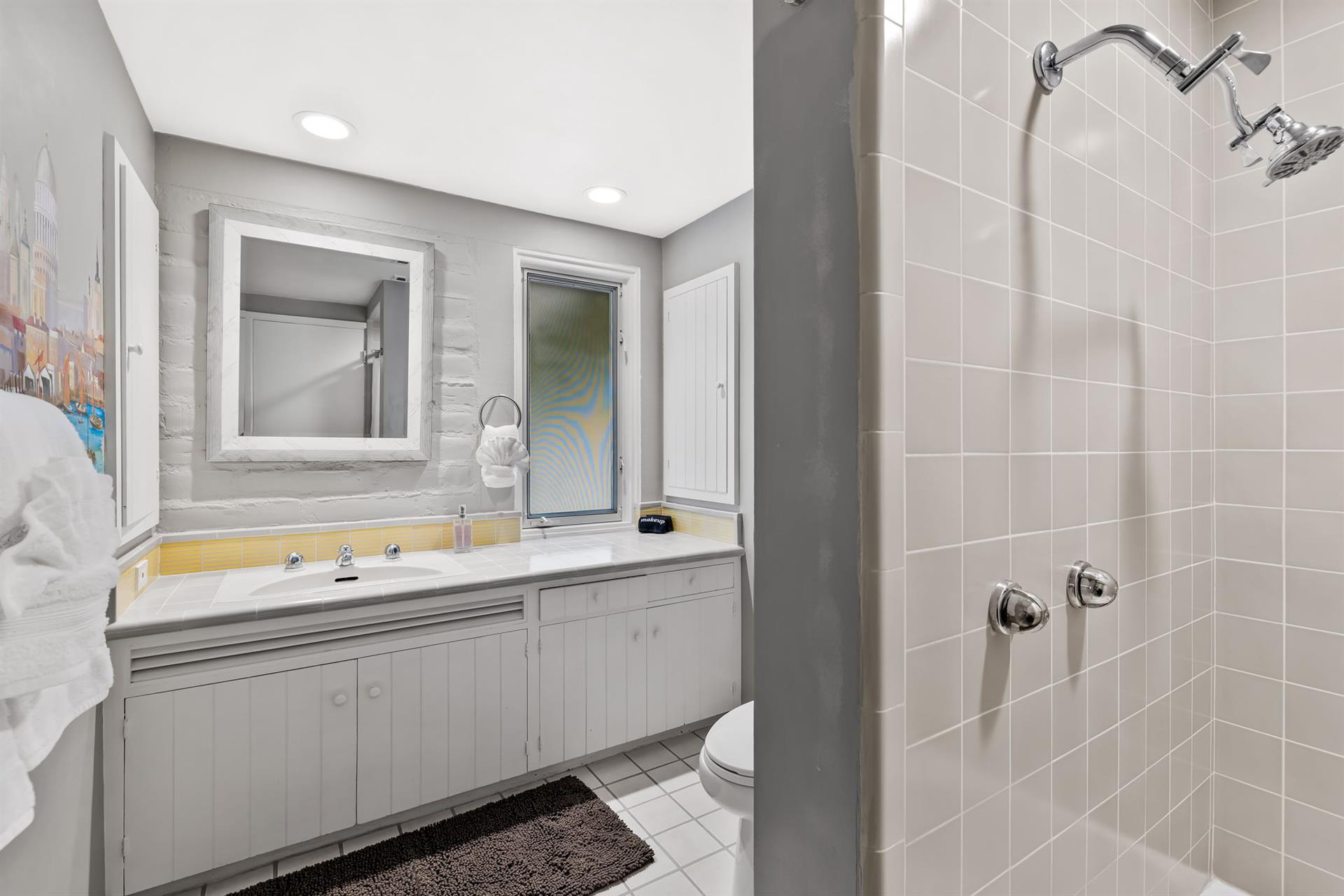Hallway Bath has a Shower