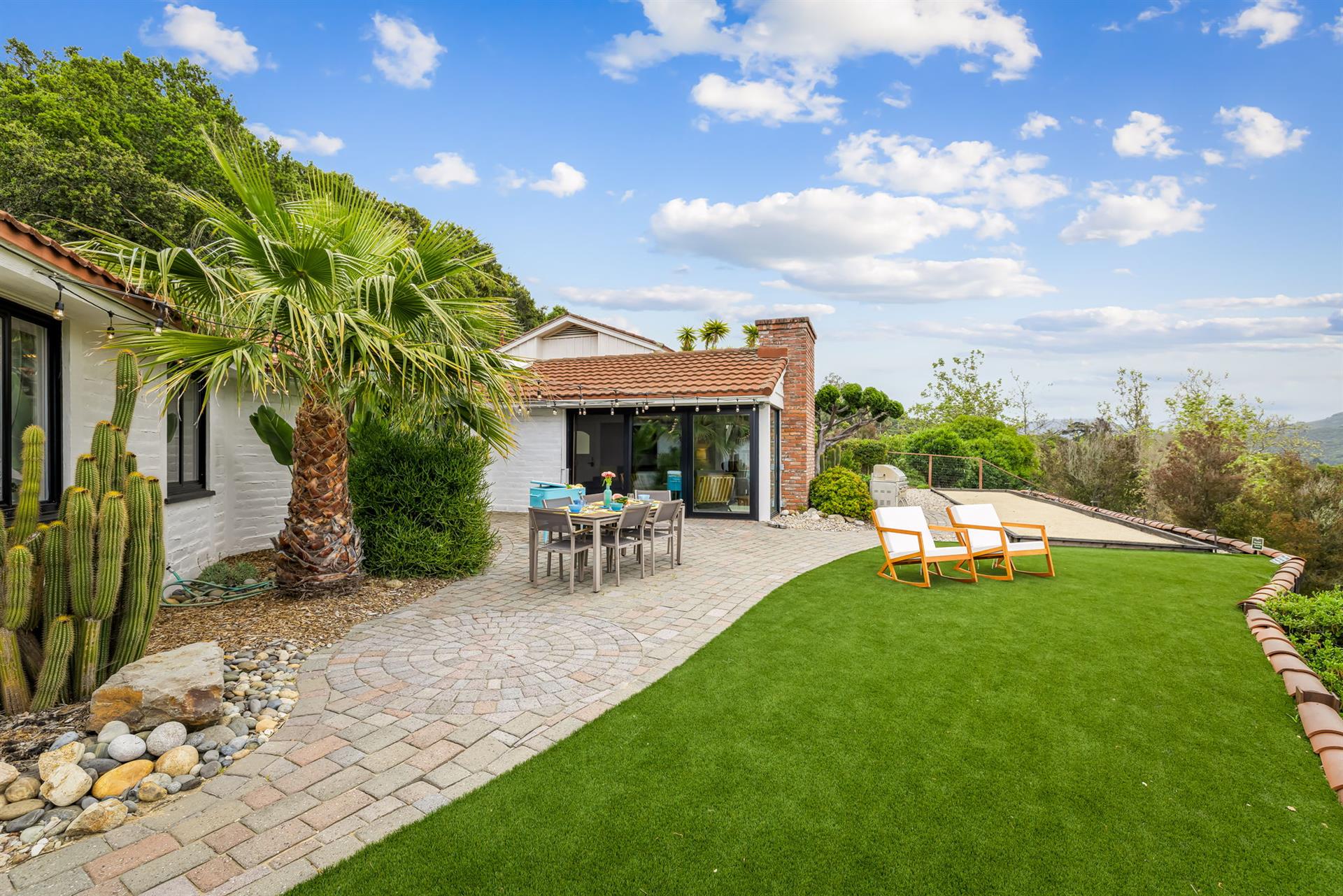 Backyard has a Gas BBQ Grill, Dining Area, Bocce Ball and More