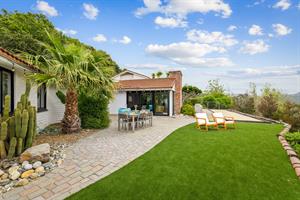 Backyard has a Gas BBQ Grill, Dining Area, Bocce Ball and More