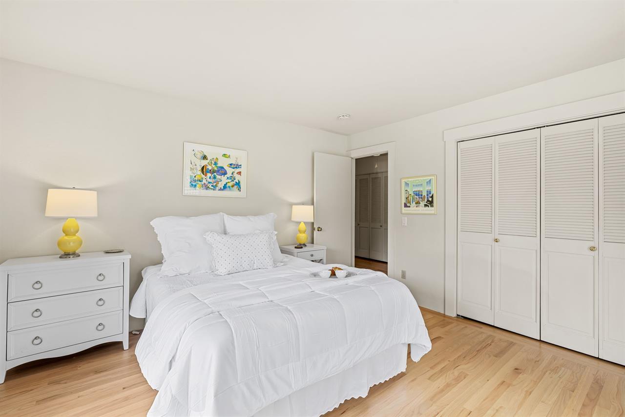 Bedroom 2  Queen Bed and a TV that Rolls Out of the Closet