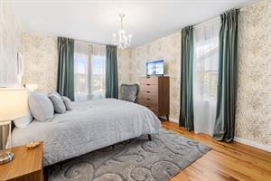 Bedroom 2 with a Queen Bed and TV