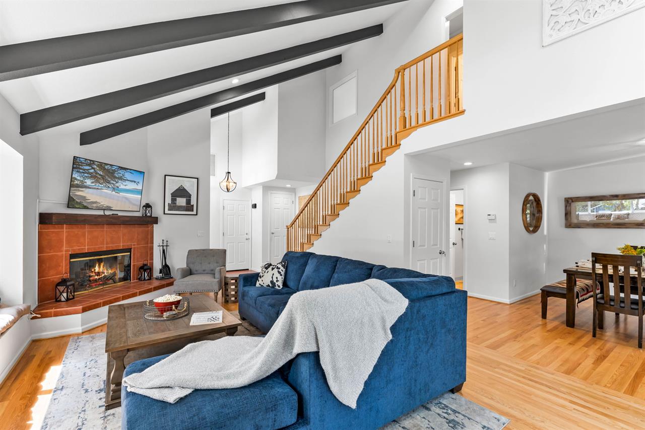 Living Room is LightFilled and has Beautiful Oak Floors