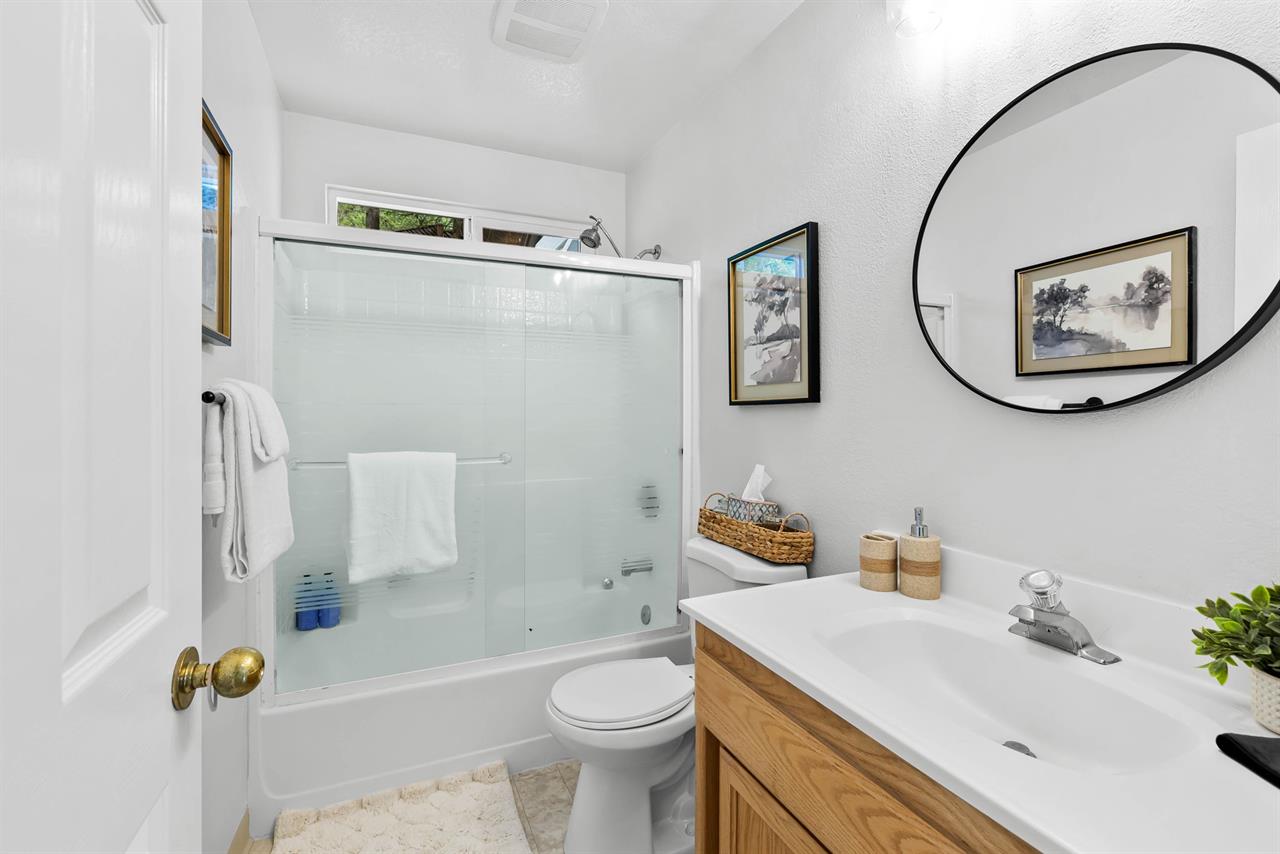 Downstairs Bathroom has a Shower Over Tub