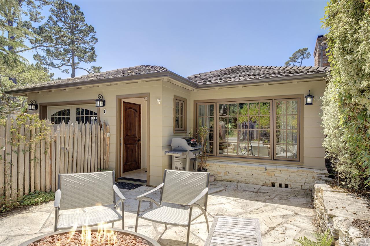 Entrance to the Home has a Patio with a Fire Pit and Gas BBQ