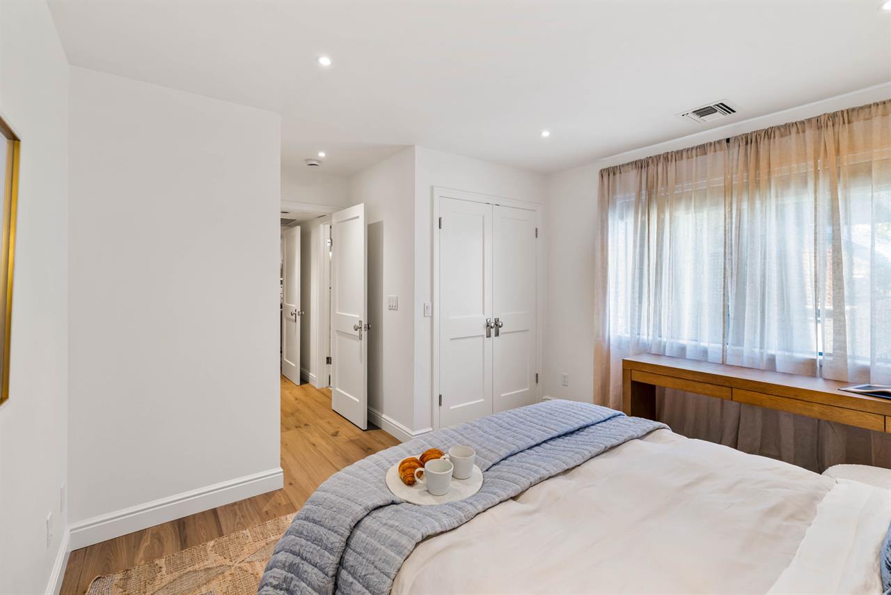 Bedroom 2 has a Queen Bed and a Desk