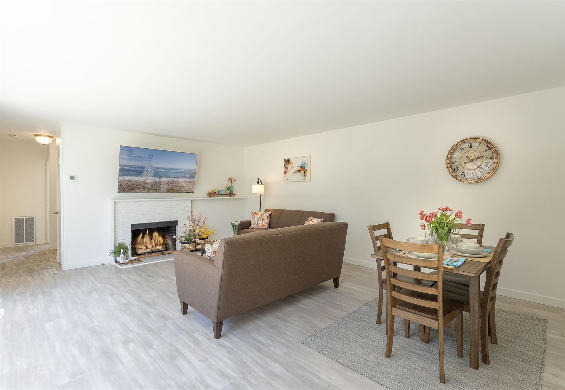 Living Room has a Gas Fireplace, TV and Dining for Four