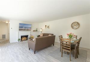 Living Room has a Gas Fireplace, TV and Dining for Four