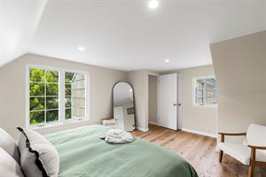 Bedroom 1 has a King Bed and EnSuite Bath with a Shower