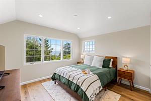 Bedroom 2 has a Queen Bed and EnSuite Bath with a Shower