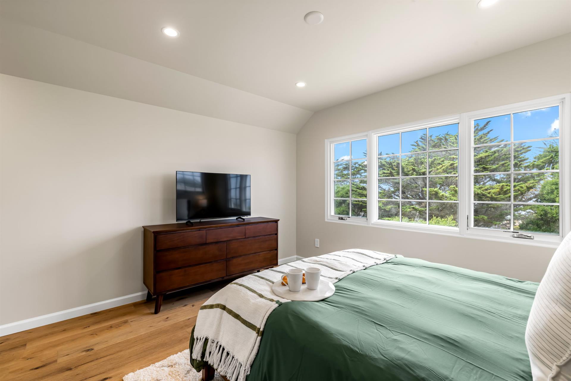 Bedroom 2 has a Queen Bed and EnSuite Bath with a Shower