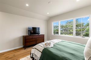 Bedroom 2 has a Queen Bed and EnSuite Bath with a Shower
