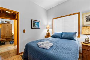 Bedroom 1 with a Queen Bed and TV