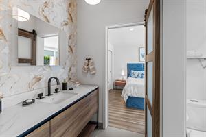 Jack and Jill Bath Between Bedrooms 3 and 4 has a Shower