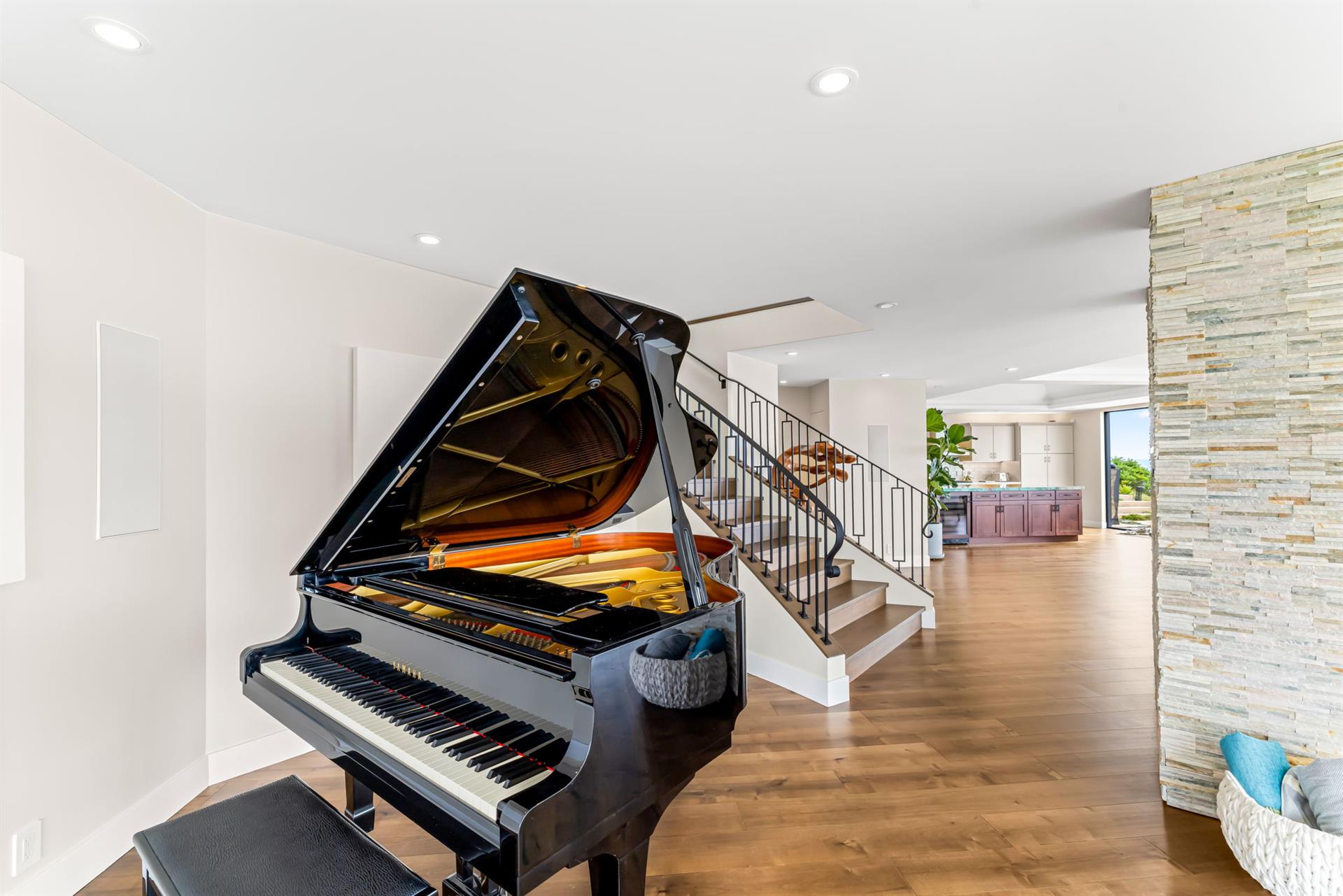 The Living Room Area Also has a Grand Piano