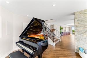 The Living Room Area Also has a Grand Piano