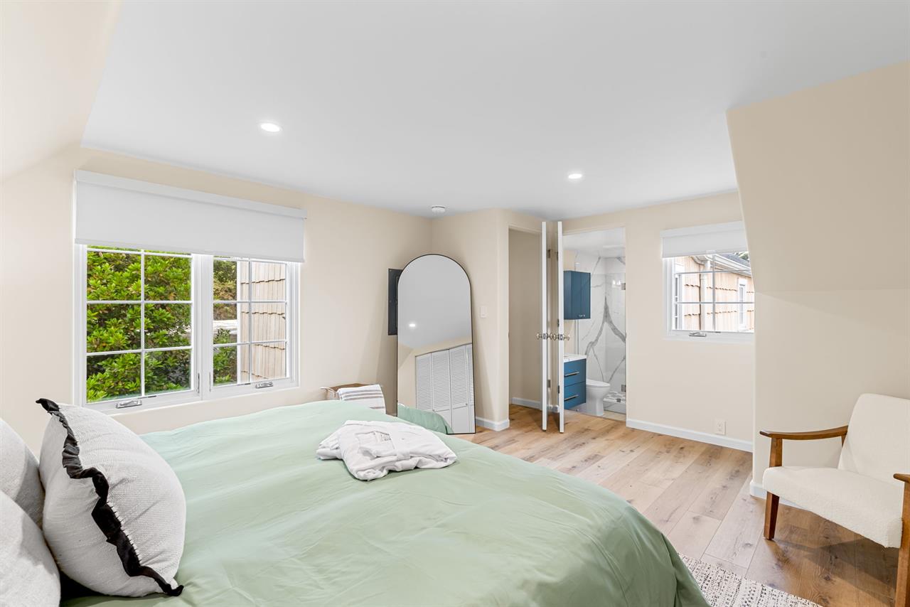 Bedroom 1 has a King Bed and EnSuite Bath with a Shower