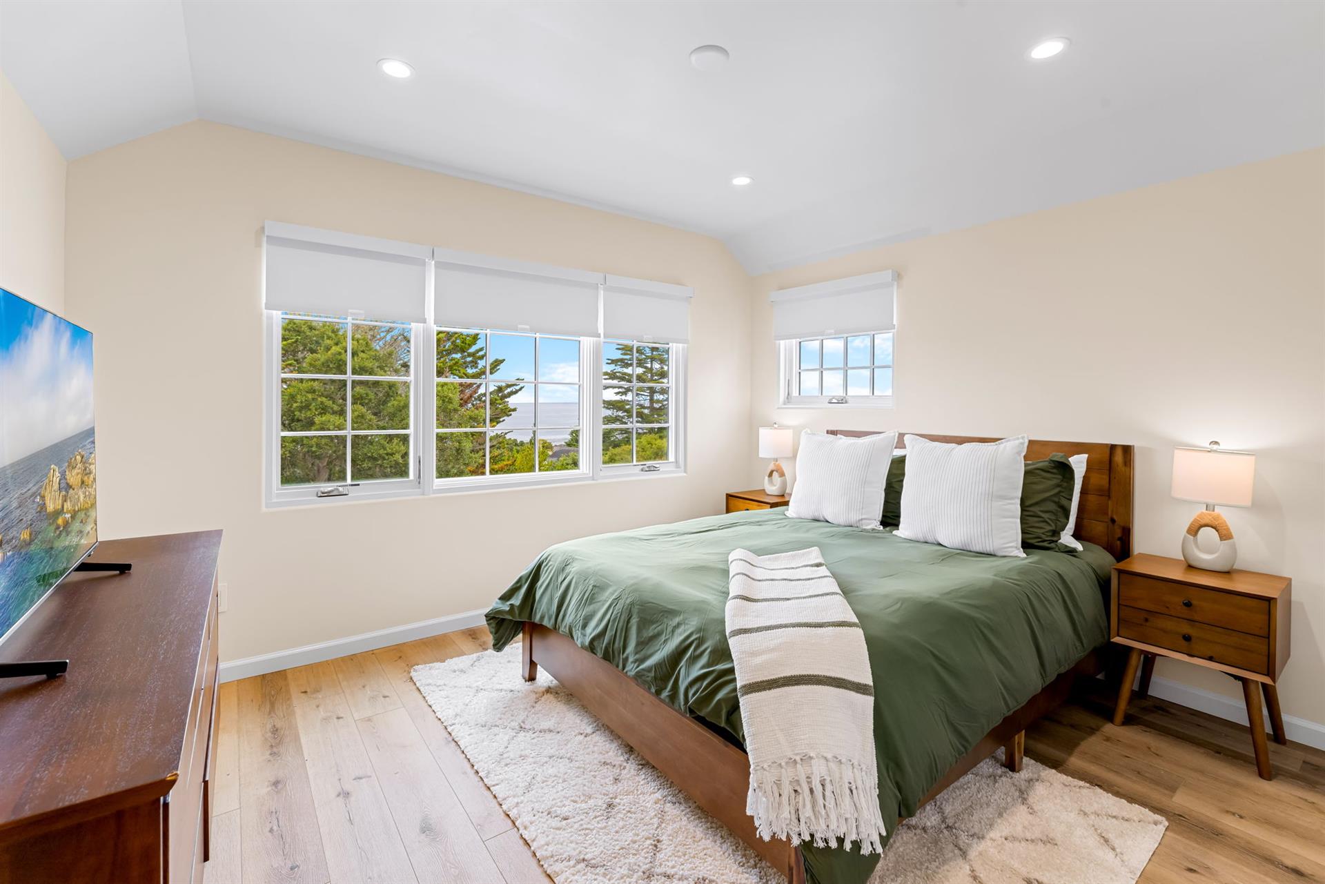 Bedroom 2 has a Queen Bed and EnSuite Bath with a Shower