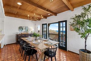 Dining Area Next to the Kitchen has a Stunning Bay View