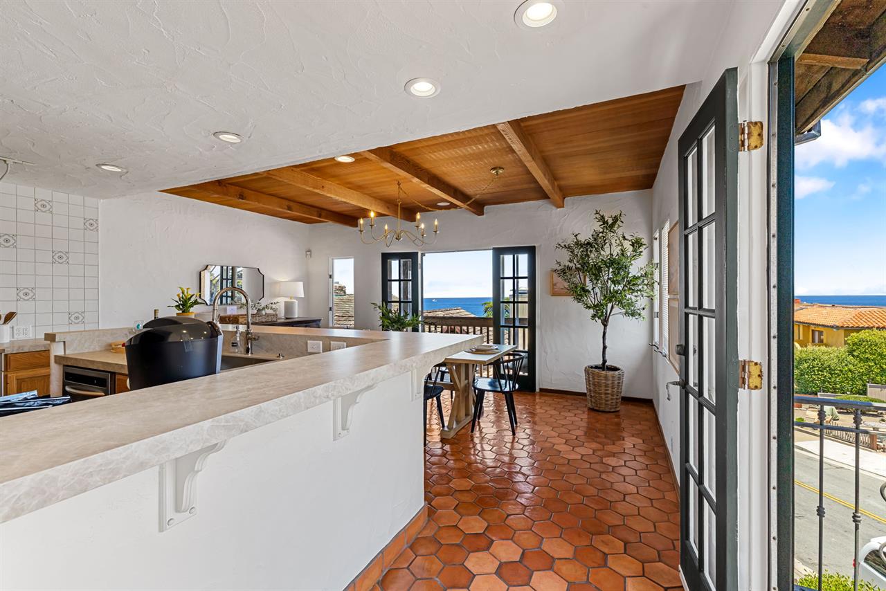 The Kitchen has French Doors and Balconies on Two Sides