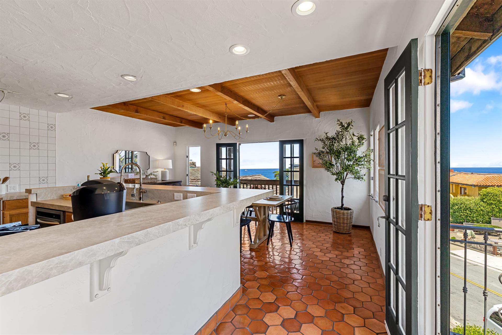 The Kitchen has French Doors and Balconies on Two Sides