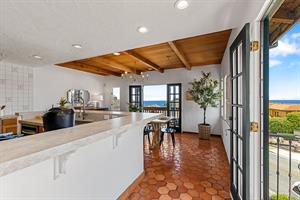 The Kitchen has French Doors and Balconies on Two Sides