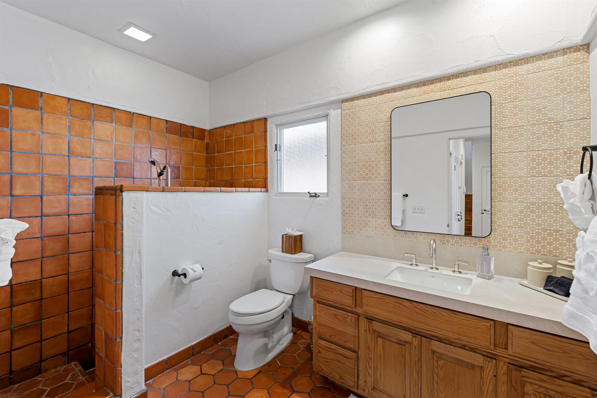 First Floor Bathroom with Tiled Step Down Shower.