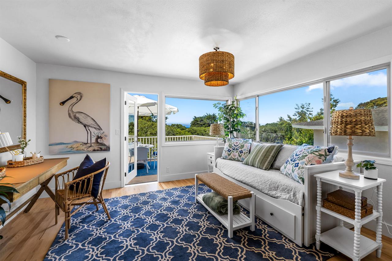 Sun Room has a Desk and Access to the Balcony