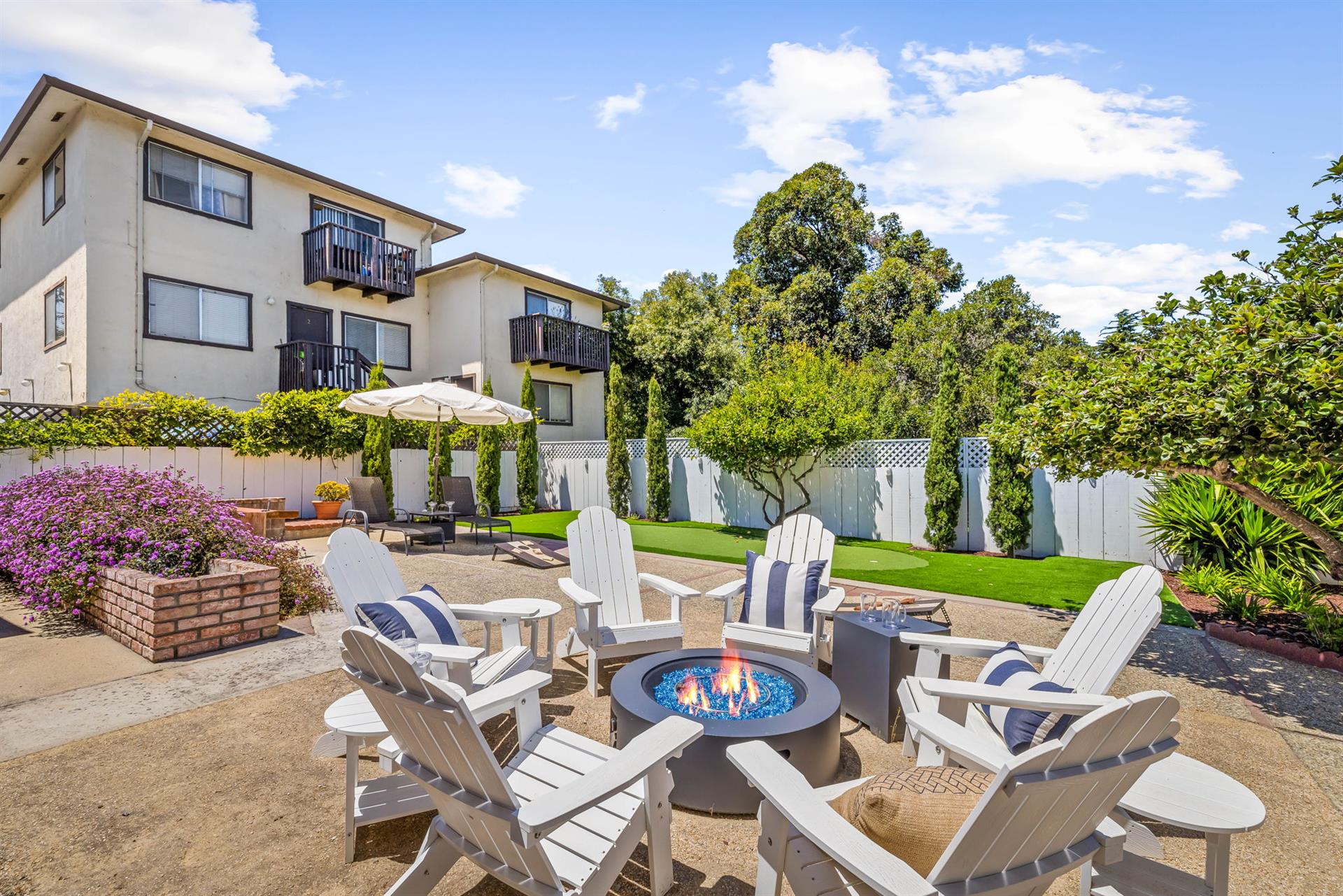 ......Gas BBQ grill,  Adirondack chairs around a Gas Fire Pit...