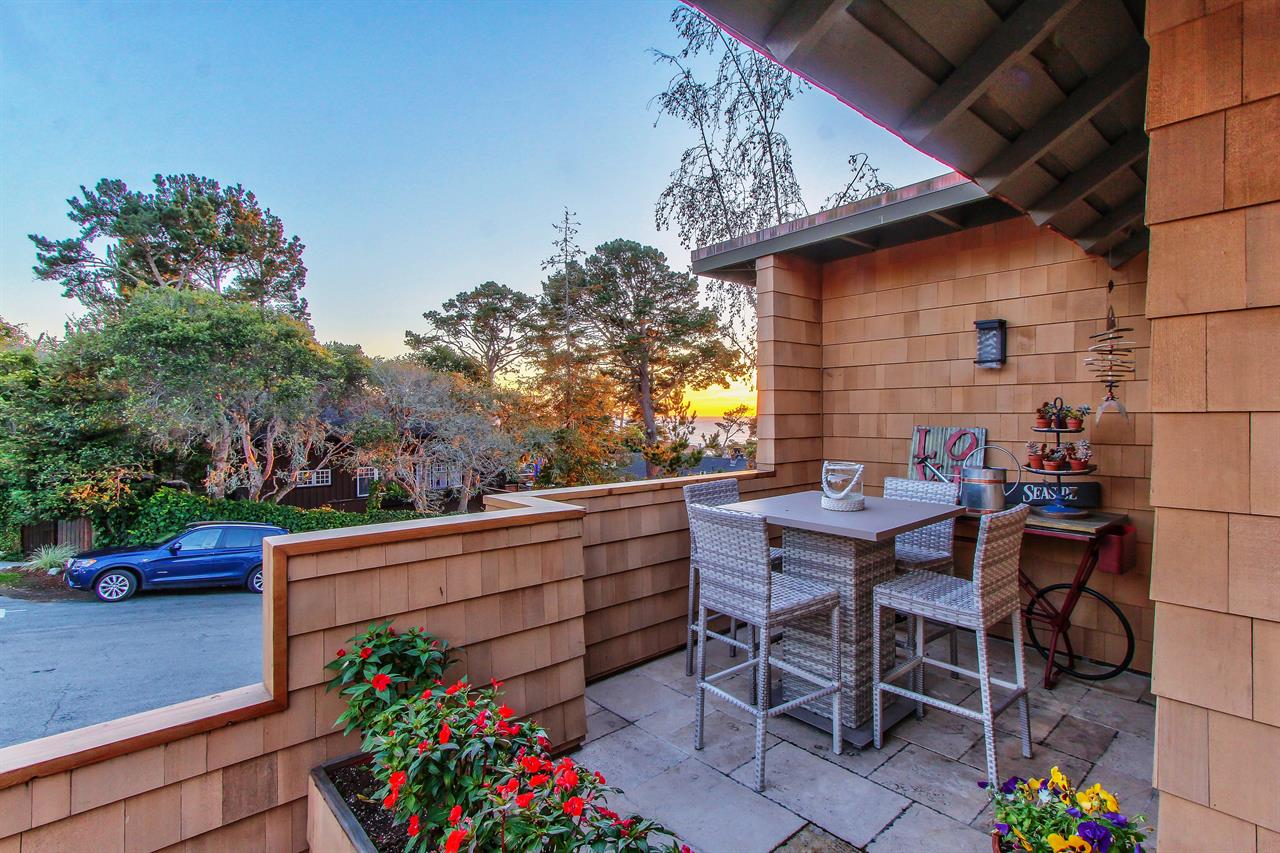 Outdoor Dining with a Distant Ocean View at Sunset