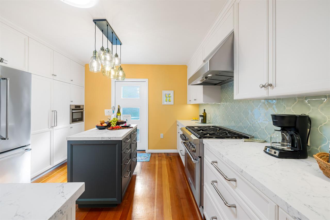 Fully Equipped Kitchen Opens to the Outdoor Dining Deck