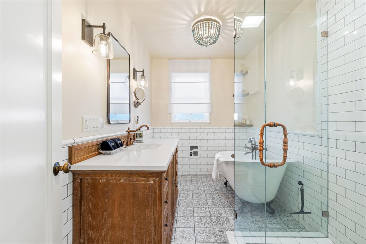 Hall Bathroom has a Shower and a Separate Tub