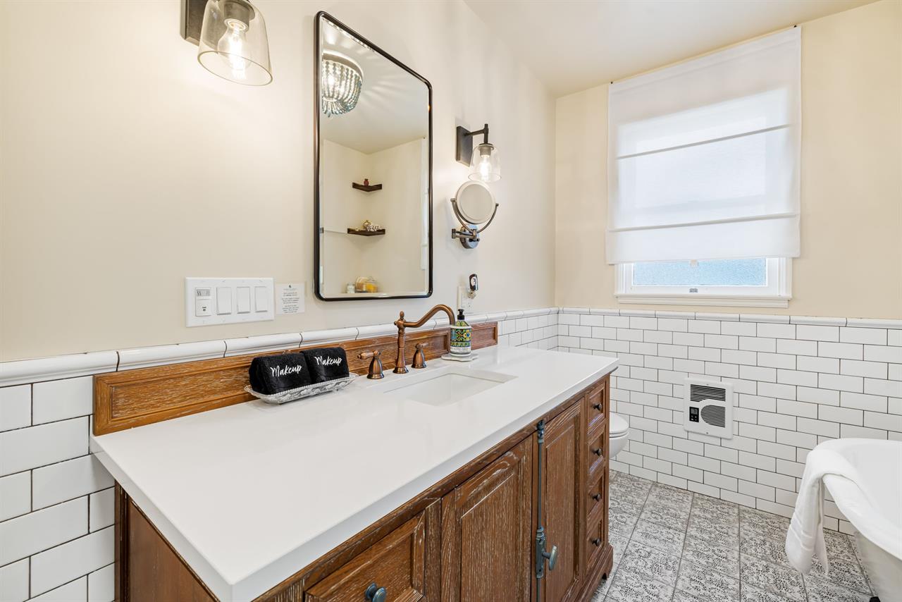 Hall Bathroom has a Shower and a Separate Tub