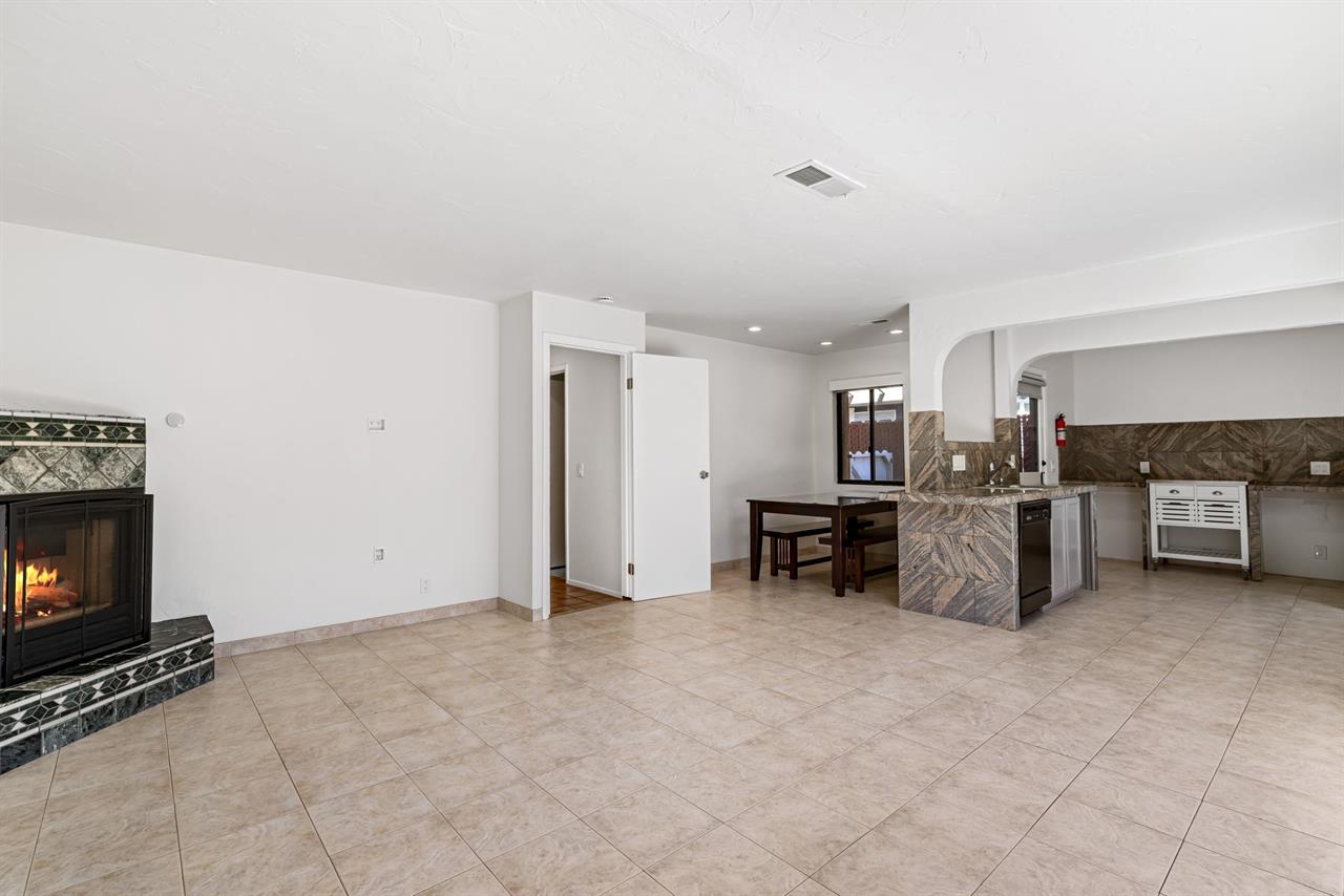 Family Room has a Gas Fireplace and Partial Kitchen