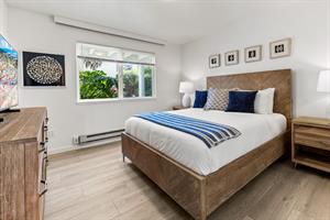 Bedroom 2 with a Queen Bed and TV