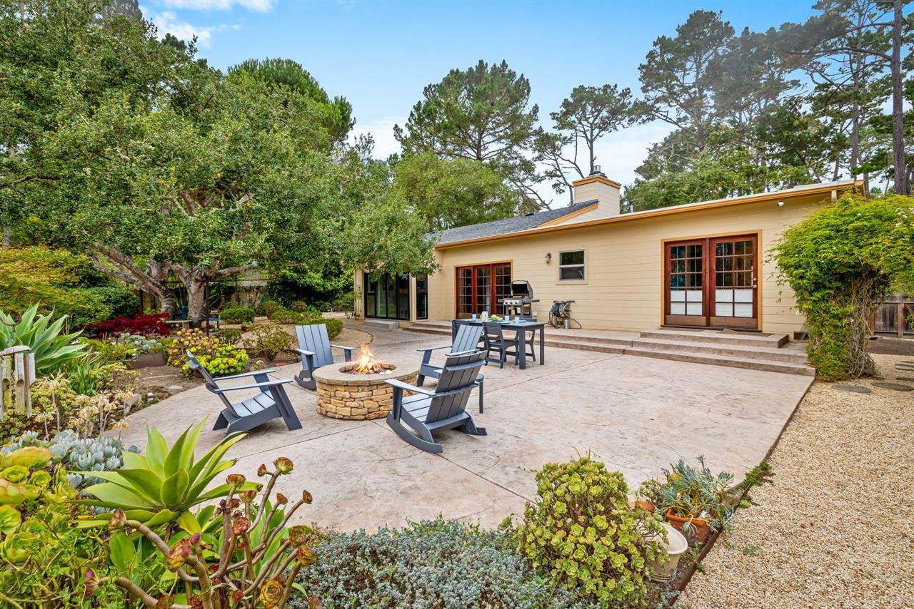 Backyard has a Gas Grill, Dining Area and Firepit