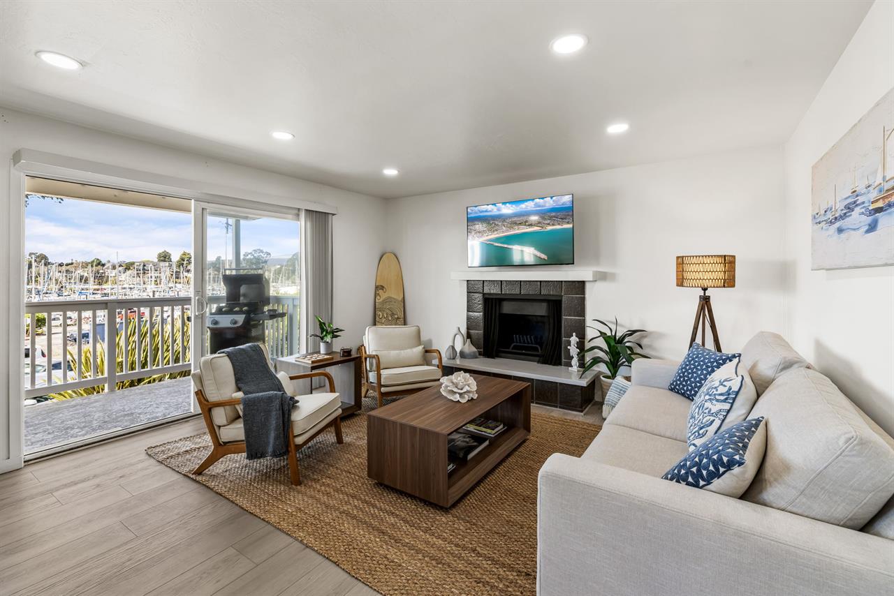 Living Room has Sliders to a Balcony with a View of the Harbor